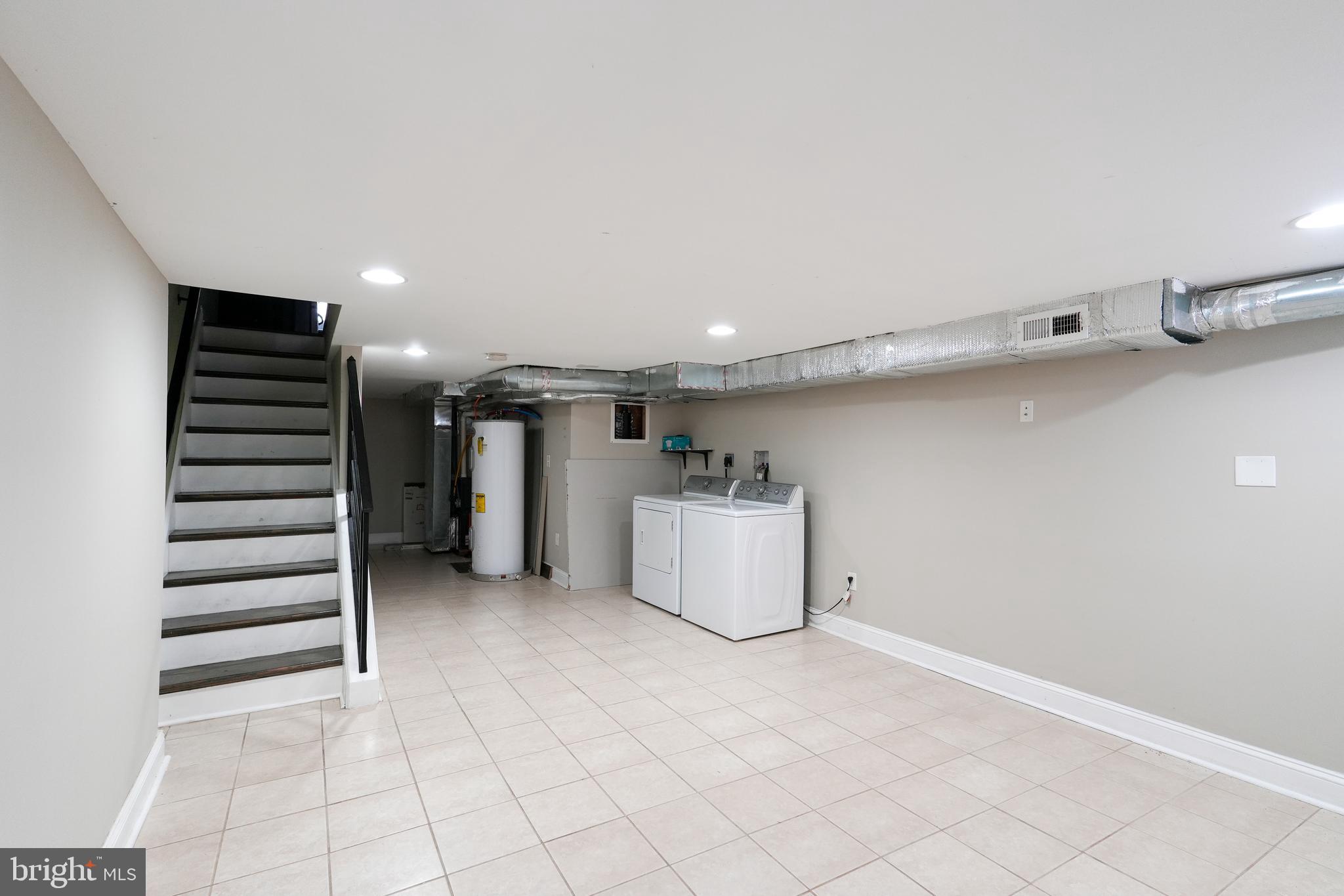 2633 Tasker Street Philadelphia, PA 19145 - Photo 22 of 23 a view of a storage & utility room with two washing machine