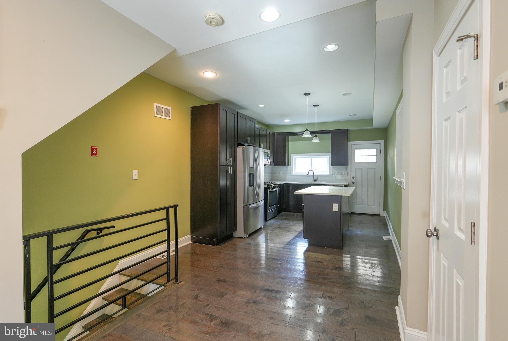 2633 Tasker Street Philadelphia, PA 19145 - Photo 5 of 23 a kitchen with a refrigerator and a sink