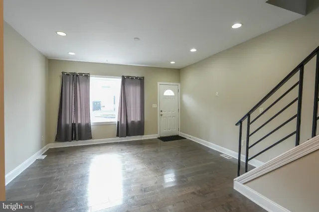 a view of an empty room with a window