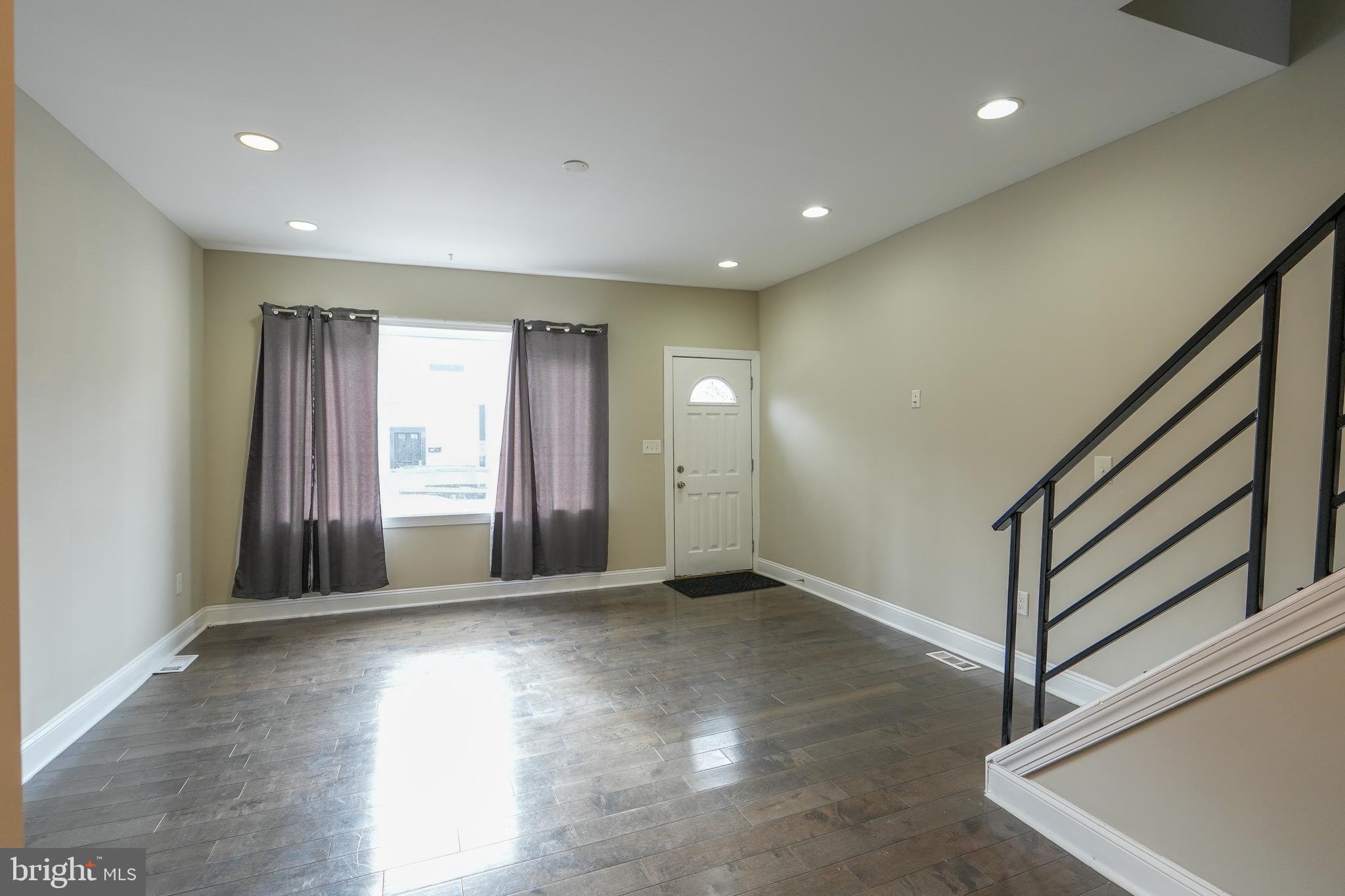 2633 Tasker Street Philadelphia, PA 19145 - Photo 6 of 23 a view of an empty room with a window