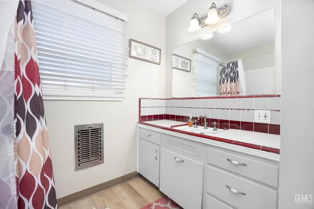 a spacious bedroom with a bed and window