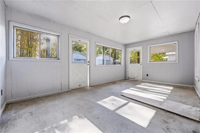 a view of room with window and furniture