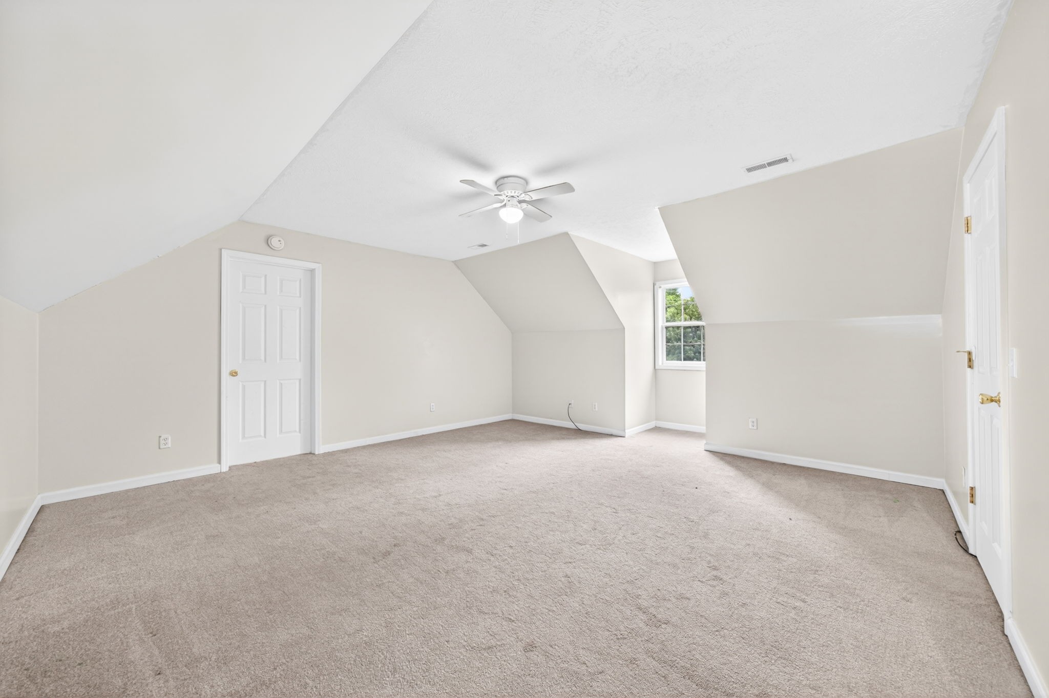 291 Poplar Point Lane Rickman, TN 38580 - Photo 23 of 41 an empty room with a ceiling fan and a window