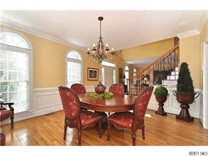 1502 Windy Ridge Road Charlotte, NC 28270 - Photo 6 of 15 a view of a dining room with furniture window and wooden floor