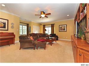 1502 Windy Ridge Road Charlotte, NC 28270 - Photo 9 of 15 a living room with furniture a ceiling fan and a rug