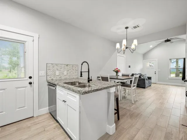a view of a kitchen from a dining room