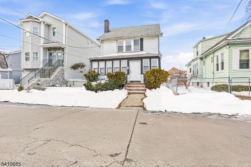 338 East 19th Street Paterson, NJ 07524 - Photo 2 of 30 a view of a building with a yard