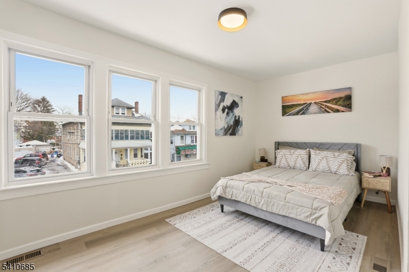 338 East 19th Street Paterson, NJ 07524 - Photo 23 of 30 a bedroom with a bed and a window