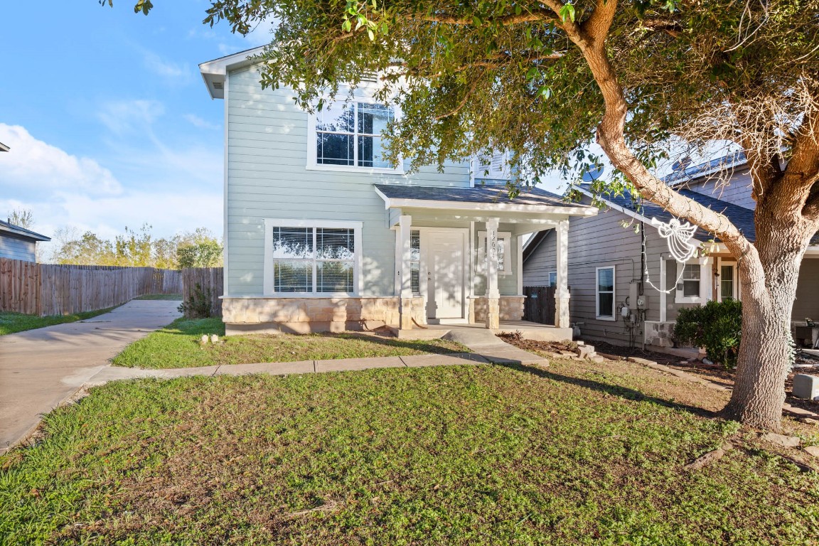 front view of a house with a large yard