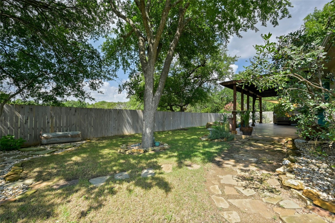7614 Buck Meadow Drive Georgetown, TX 78628 - Photo 23 of 30 a backyard of a house with lots of green space