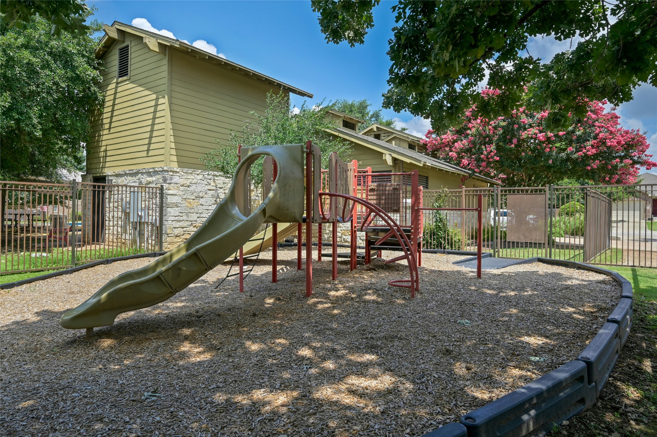 7614 Buck Meadow Drive Georgetown, TX 78628 - Photo 30 of 30 This playground is connected to the community pool.