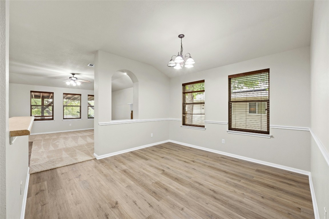 7614 Buck Meadow Drive Georgetown, TX 78628 - Photo 10 of 30 a view of an empty room with window and wooden floor