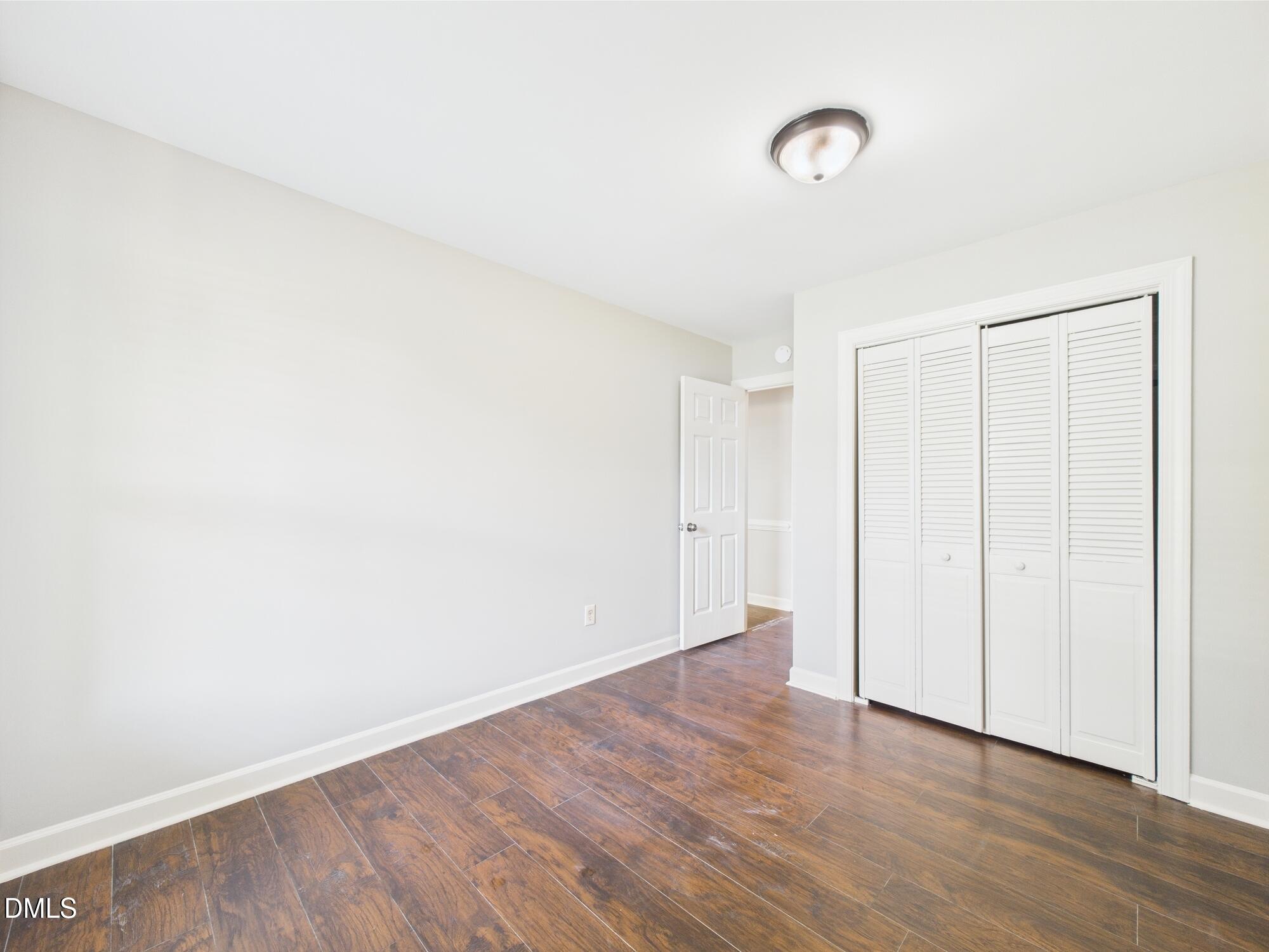10917 Fanny Brown Road Raleigh, NC 27603 - Photo 39 of 54 a view of an empty room with wooden floor
