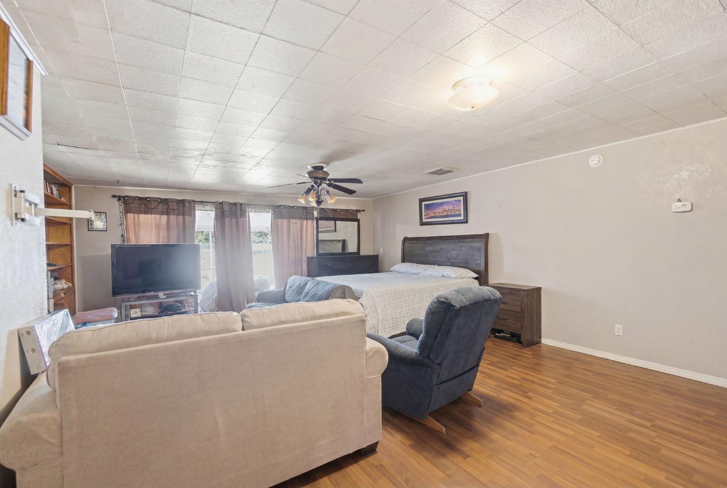 1705 Stetson Avenue Modesto, CA 95350 - Photo 21 of 32 a bed room with a bed and a television