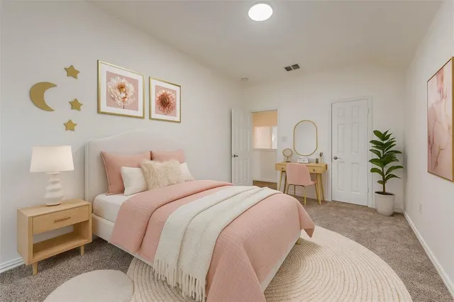 a bedroom with bed and a potted plant