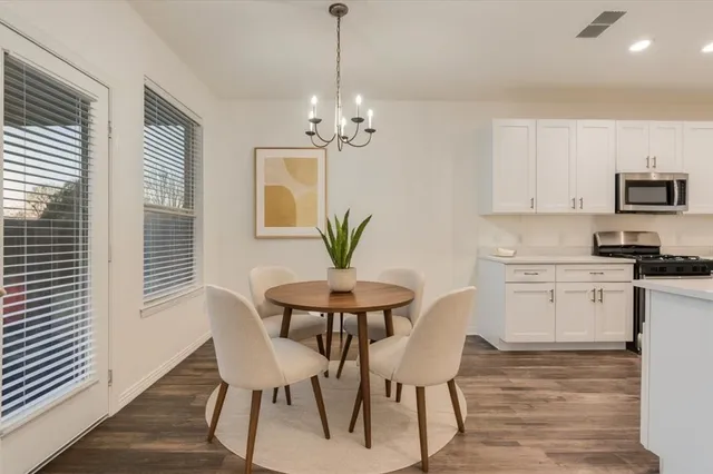a view of kitchen with sink and dining area