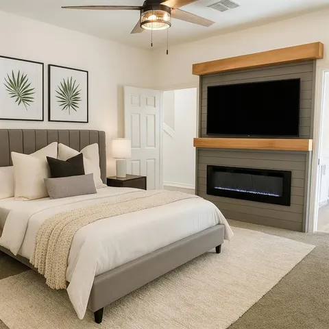 a bedroom with a bed and a fireplace