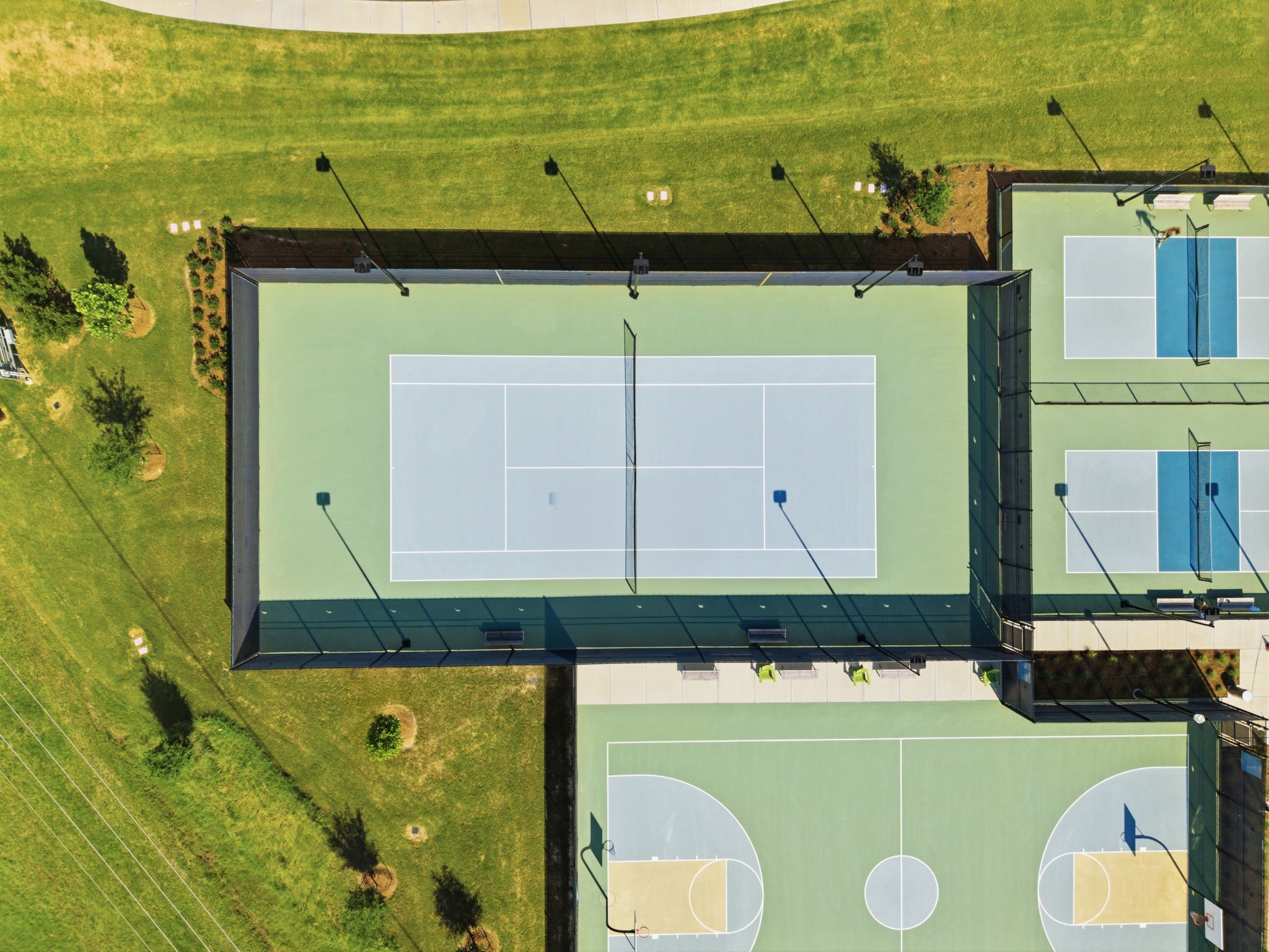 2119 Blackhawk Ridge Lane Manvel, TX 77578 - Photo 40 of 49 Stay active right in your own community! Pomona offers world-class recreational facilities including a full-size basketball court, pickleball courts, tennis courts, sand volleyball, and more — all beautifully maintained and lit for evening play.