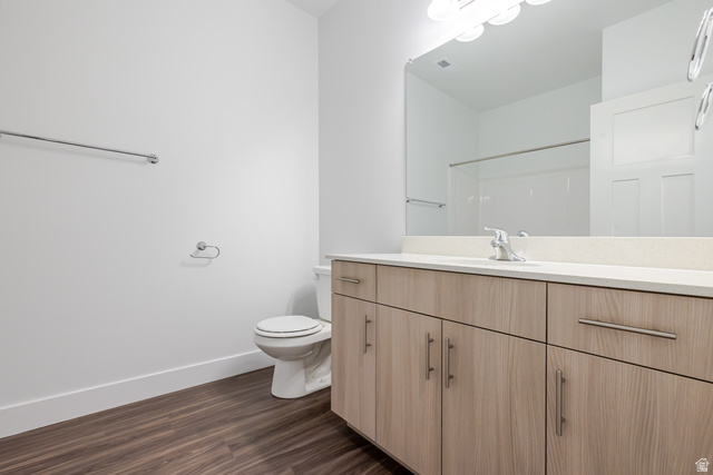 4662 Poplar Way, Unit Q303 Mapleton, UT 84664 - Photo 13 of 18 Bathroom with vanity, dark wood-type flooring, and a shower