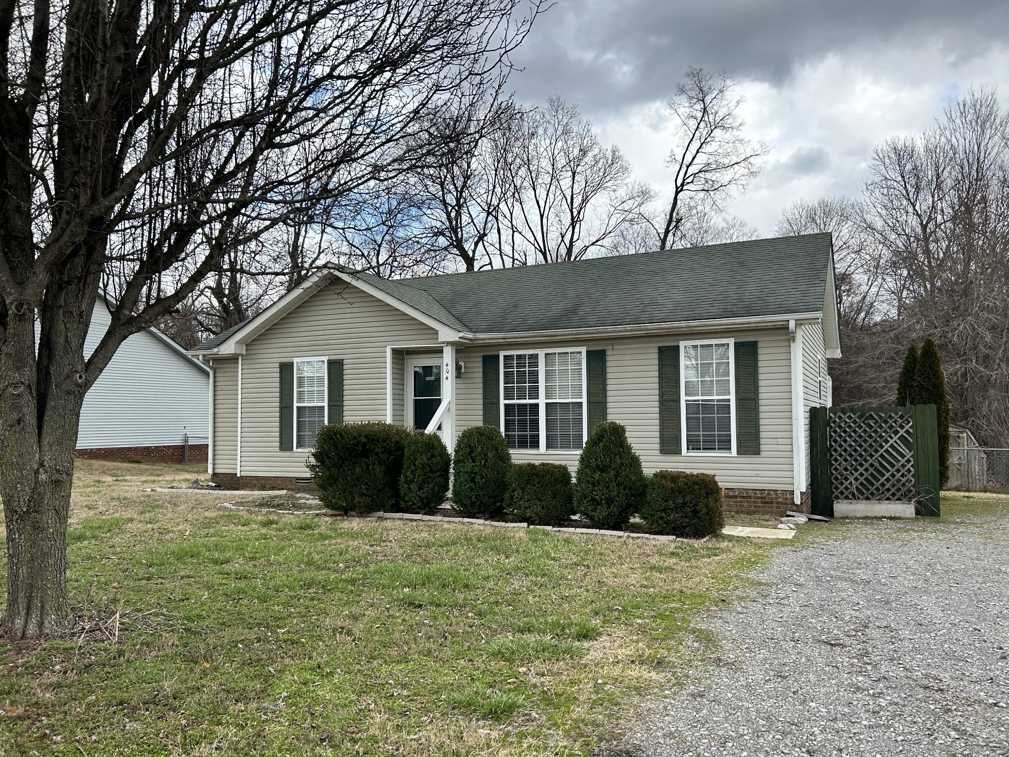 404 Sideline Drive Oak Grove, KY 42262 - Photo 1 of 14 a front view of a house with a garden