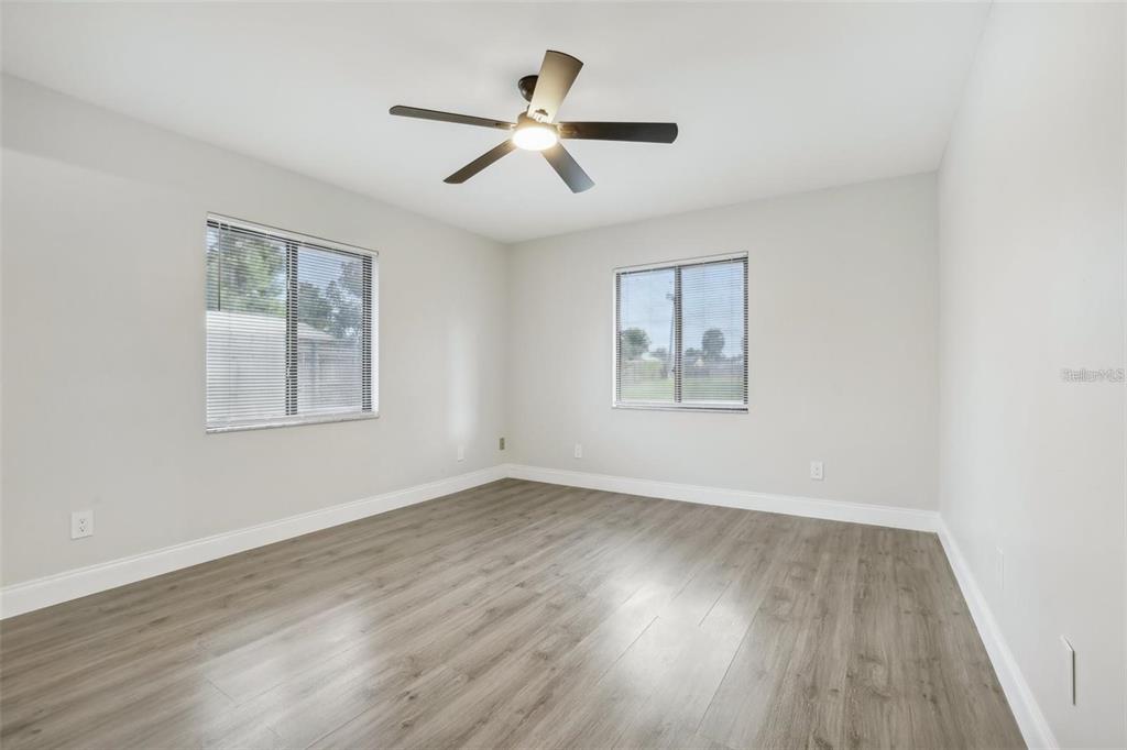 1052 Manchester Circle Winter Park, FL 32792 - Photo 24 of 41 a view of empty room with wooden floor and fan