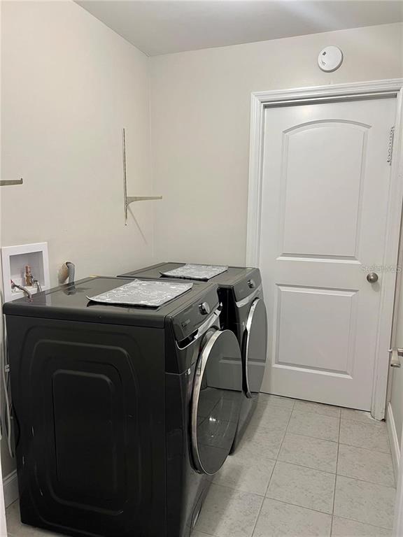 1052 Manchester Circle Winter Park, FL 32792 - Photo 30 of 41 a utility room with dryer and washer