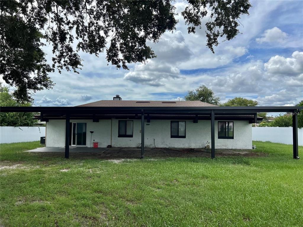 1052 Manchester Circle Winter Park, FL 32792 - Photo 32 of 41 a view of a house with a backyard