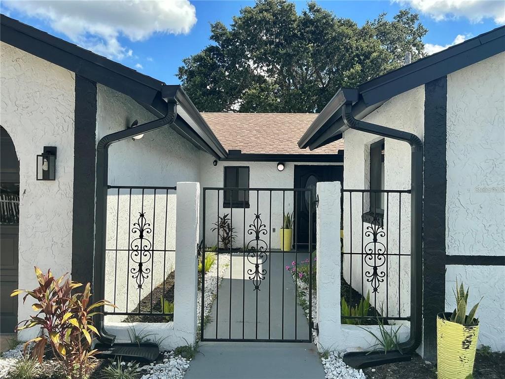 1052 Manchester Circle Winter Park, FL 32792 - Photo 4 of 41 a front view of a house with balcony