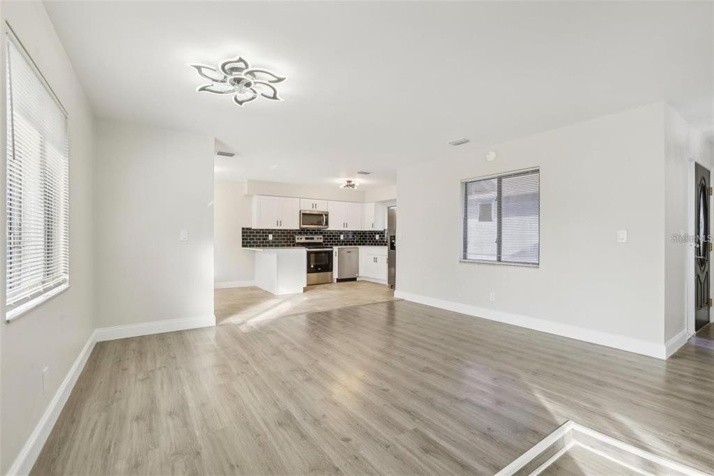 1052 Manchester Circle Winter Park, FL 32792 - Photo 9 of 41 a view of empty room with wooden floor and window