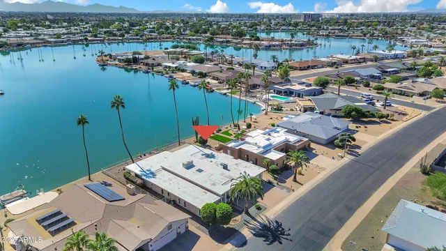 an aerial view of a house with a lake view