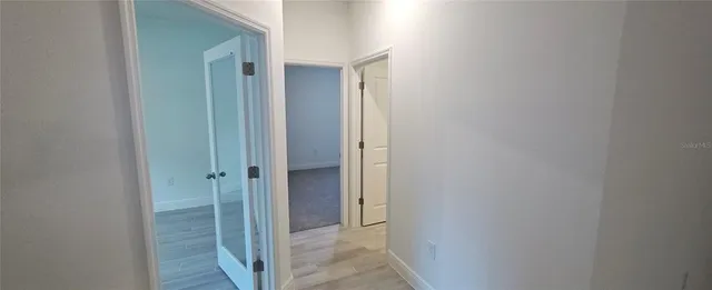 a view of a bathroom from the hallway