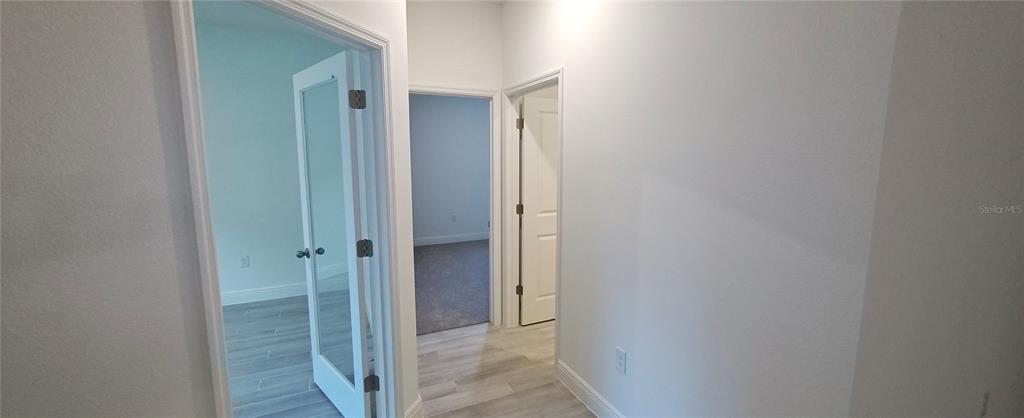 3 Undermount Path East Palm Coast, FL 32164 - Photo 5 of 13 a view of a bathroom from the hallway
