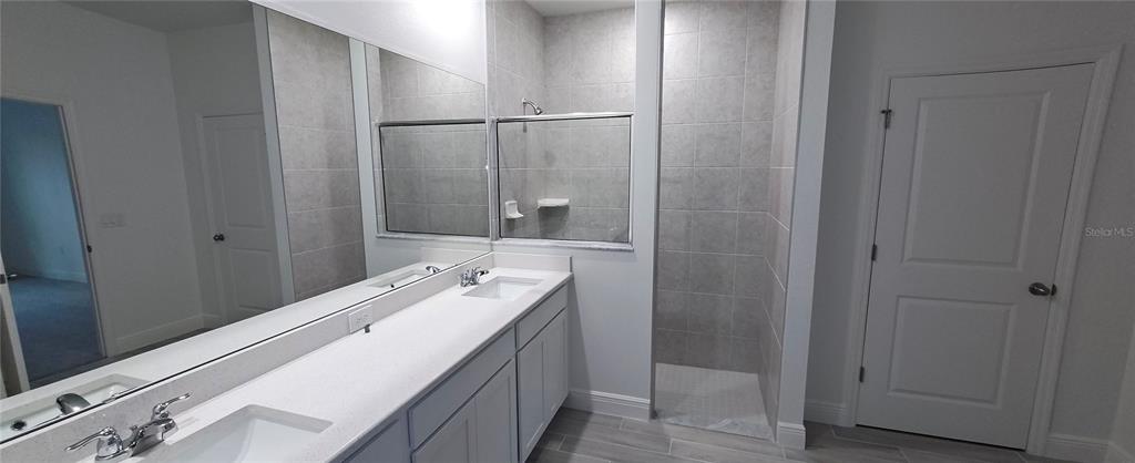 3 Undermount Path East Palm Coast, FL 32164 - Photo 6 of 13 a bathroom with a sink a toilet and shower