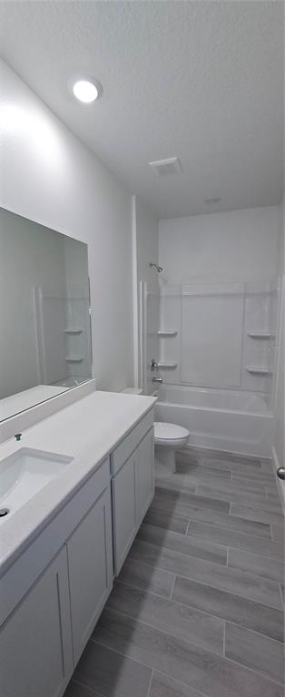 3 Undermount Path East Palm Coast, FL 32164 - Photo 7 of 13 a spacious bathroom with a granite countertop sink and a toilet