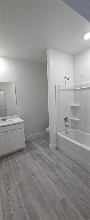 3 Undermount Path East Palm Coast, FL 32164 - Photo 9 of 13 a view of a room with wooden floor and cabinet