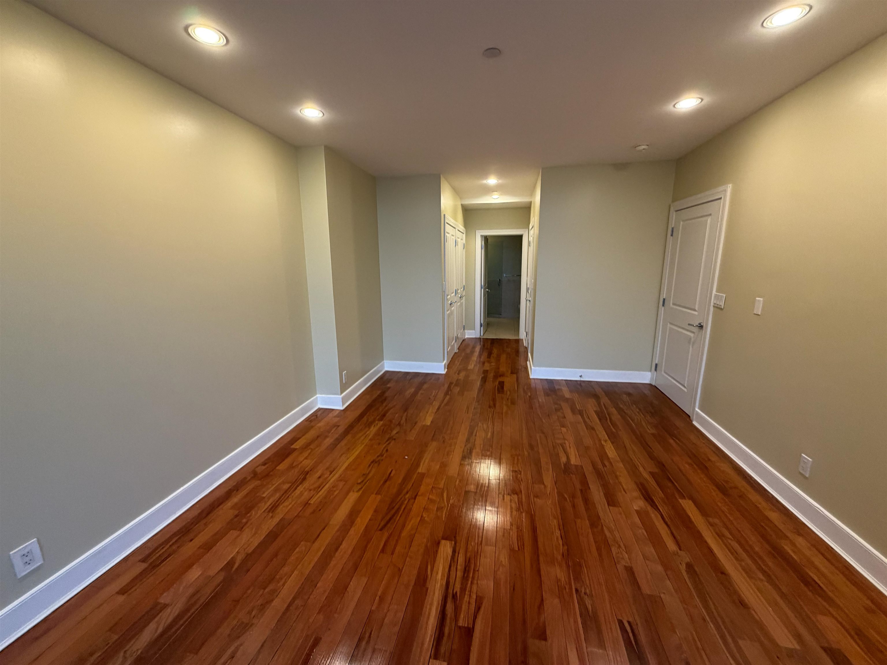 8125 River Road, Unit 3C North Bergen, NJ 07047 - Photo 14 of 24 a view of hallway with wooden floor