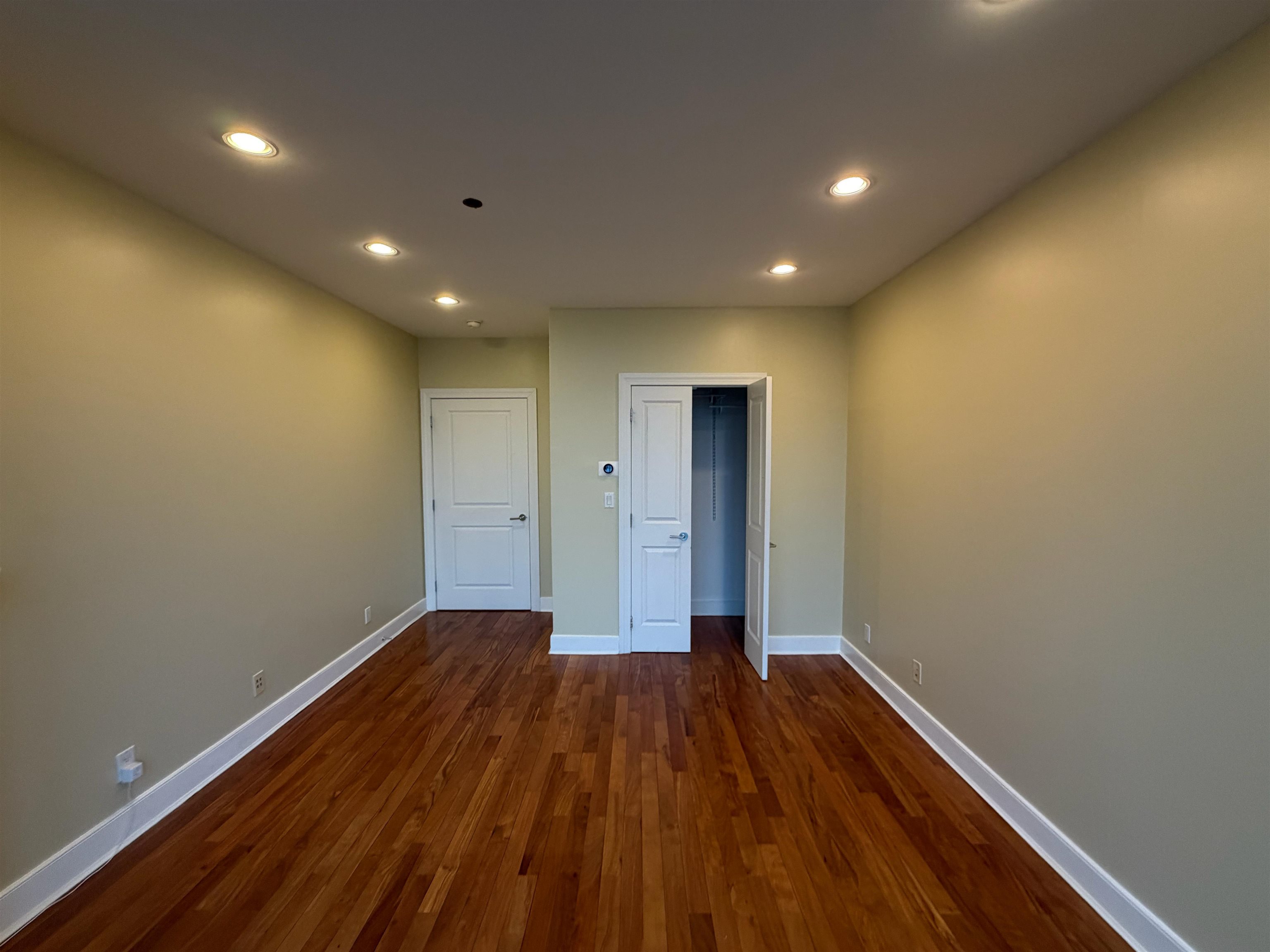 8125 River Road, Unit 3C North Bergen, NJ 07047 - Photo 18 of 24 a view of hallway with wooden floor