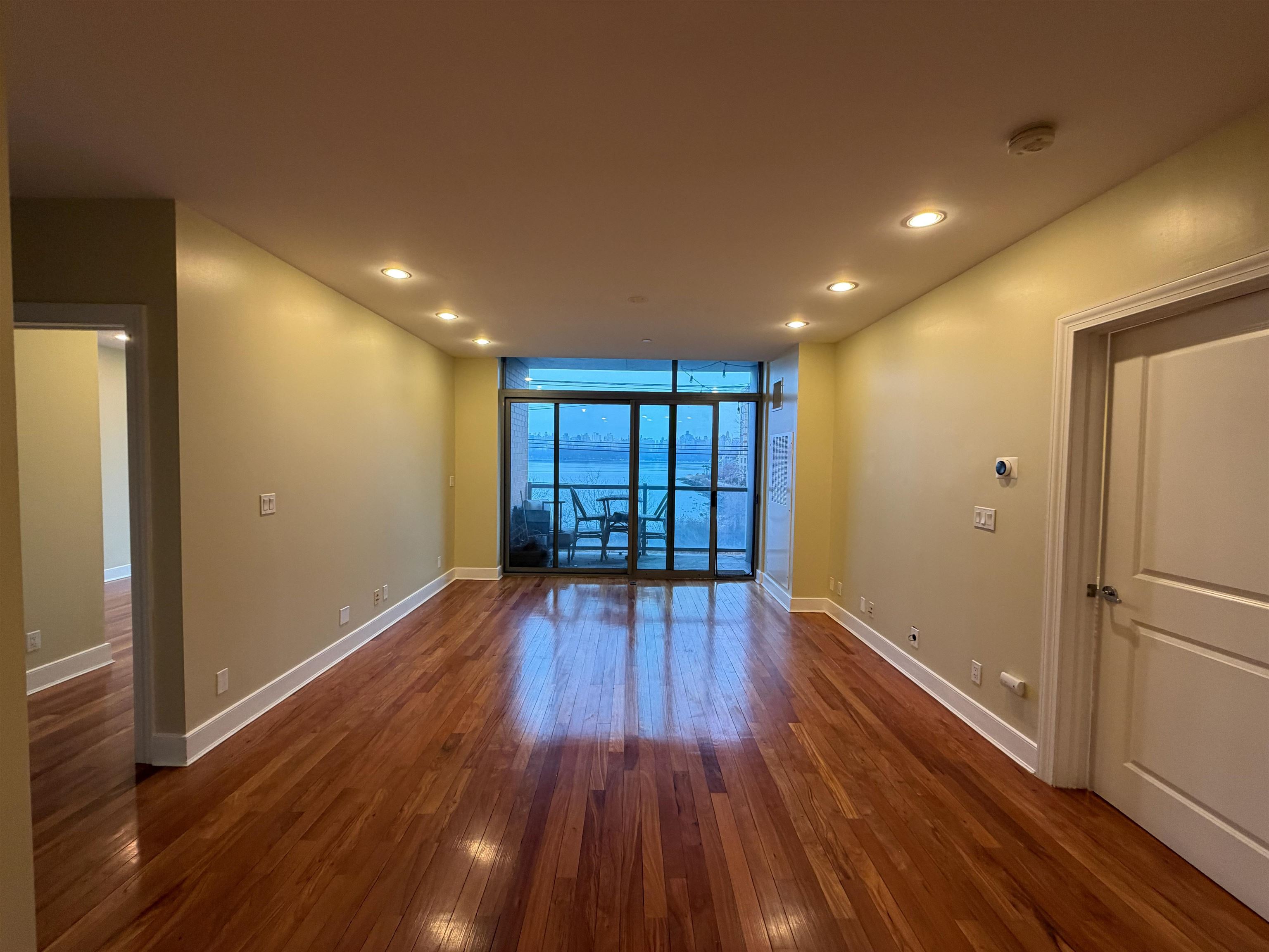 8125 River Road, Unit 3C North Bergen, NJ 07047 - Photo 9 of 24 a view of wooden floor and windows in a room