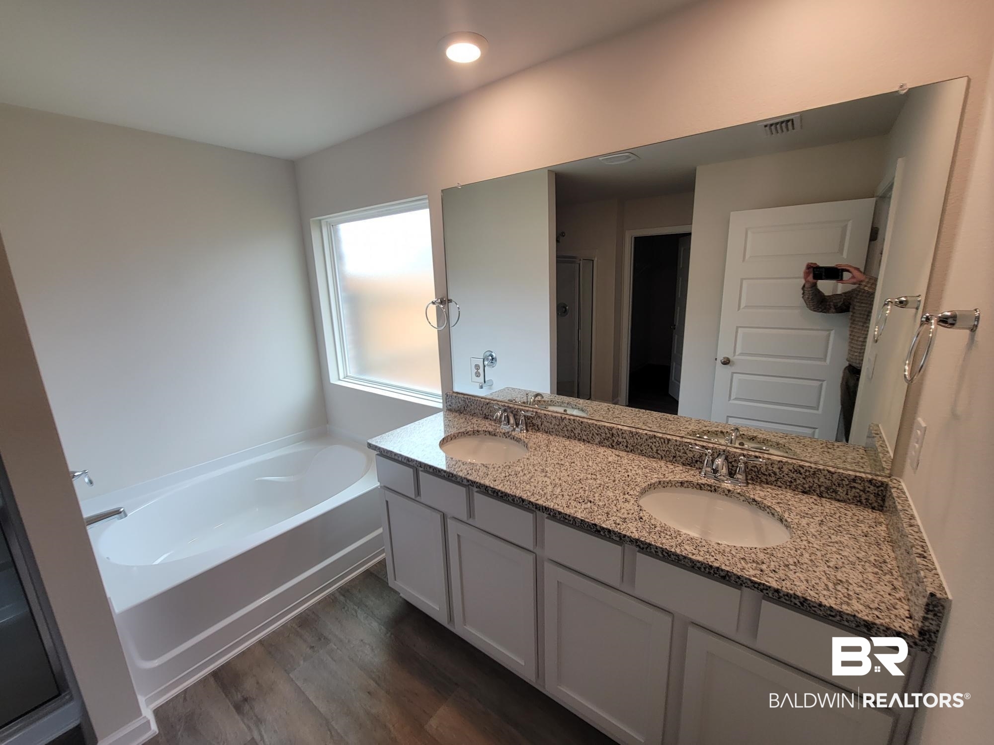 24625 Ponder Loop Loxley, AL 36551 - Photo 8 of 30 Bathroom featuring wood-type flooring, vanity, and independent shower and bath