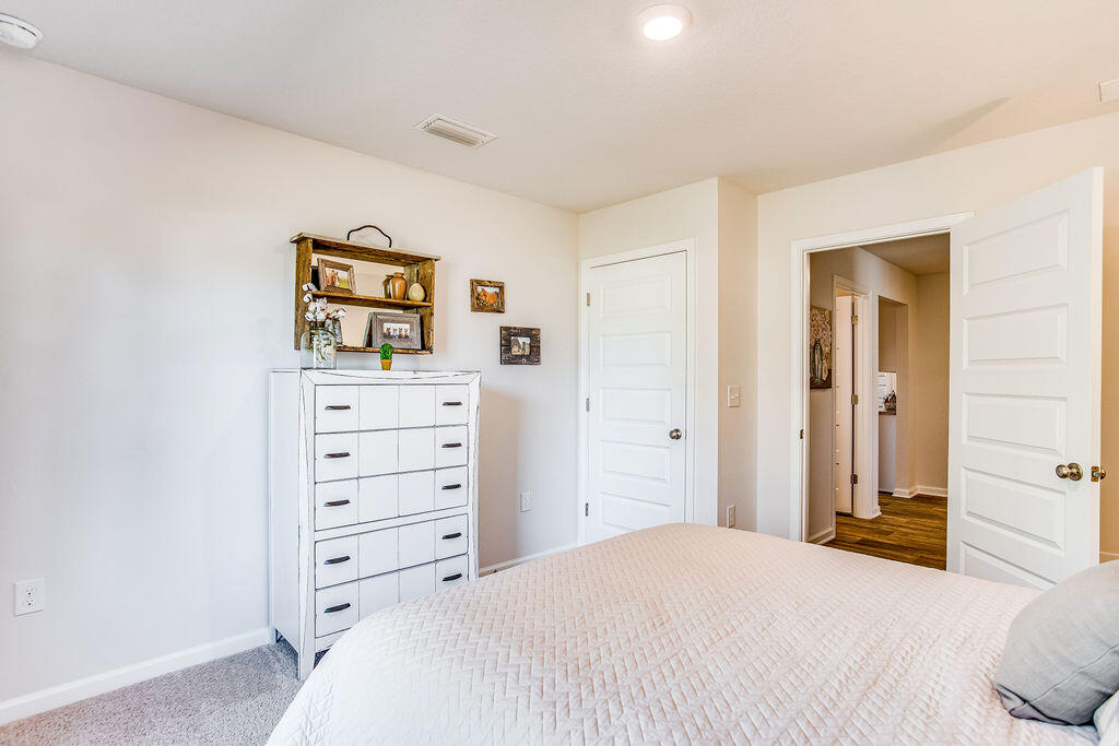 2860 Patriots Rdg Drive Crestview, FL 32539 - Photo 17 of 28 a bedroom with a bed and a dresser