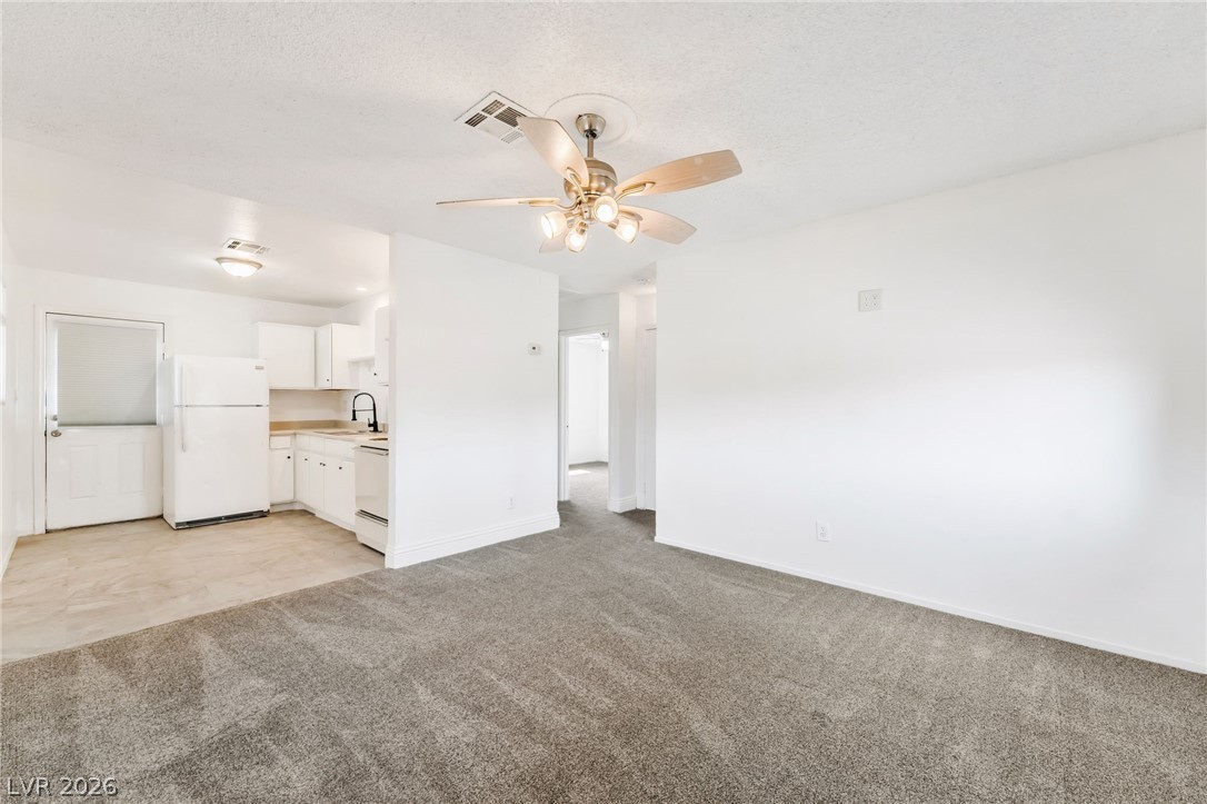 242 Nebraska Avenue Henderson, NV 89015 - Photo 34 of 46 Living room featuring NEW light colored carpet, a new paint throughout.
