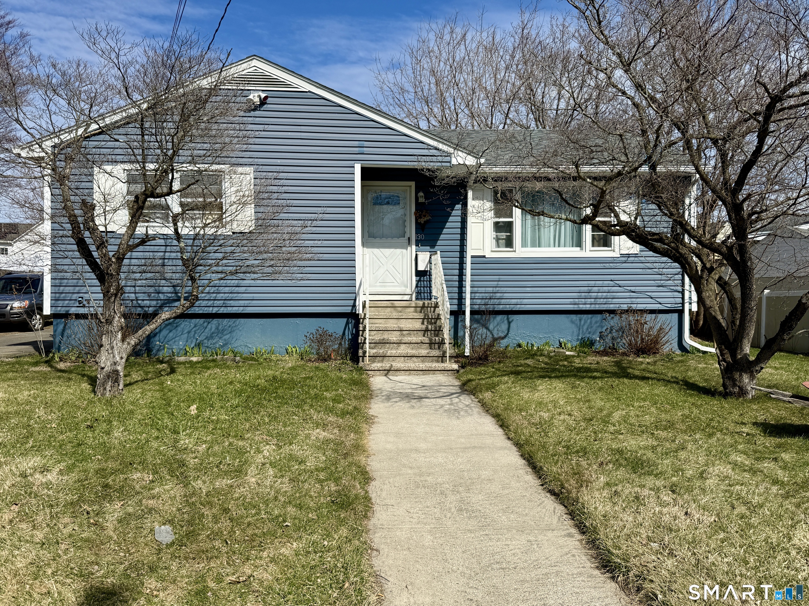 130 Holroyd Street Bridgeport, CT 06606 - Photo 1 of 29 a view of a house with a yard