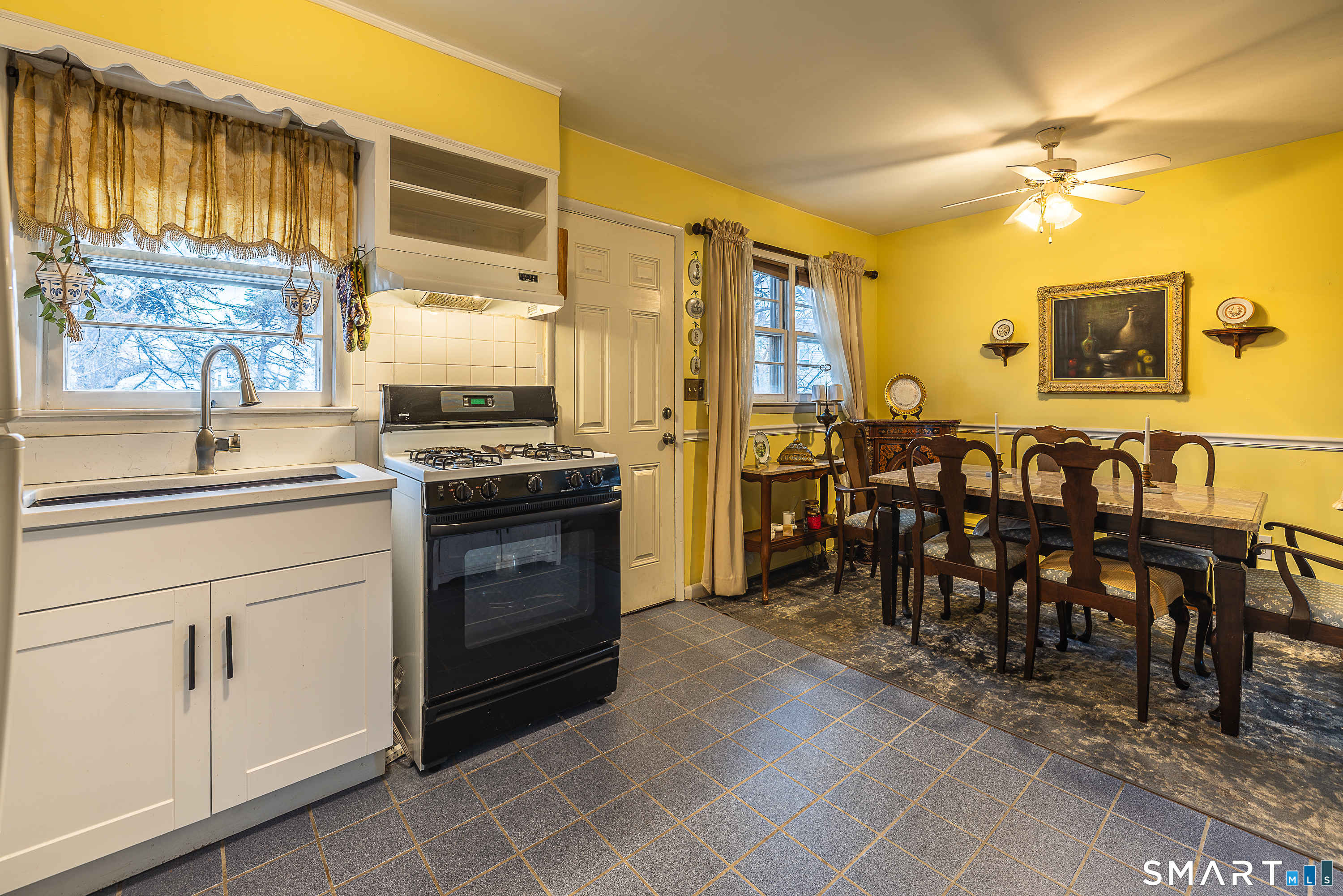 130 Holroyd Street Bridgeport, CT 06606 - Photo 12 of 29 a kitchen with appliances cabinets and furniture