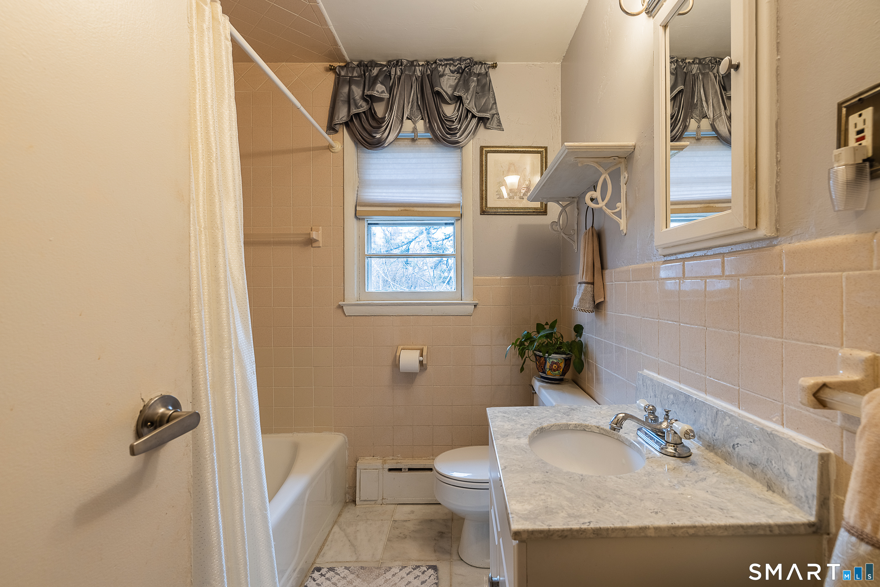 130 Holroyd Street Bridgeport, CT 06606 - Photo 15 of 29 a bathroom with a sink toilet and shower