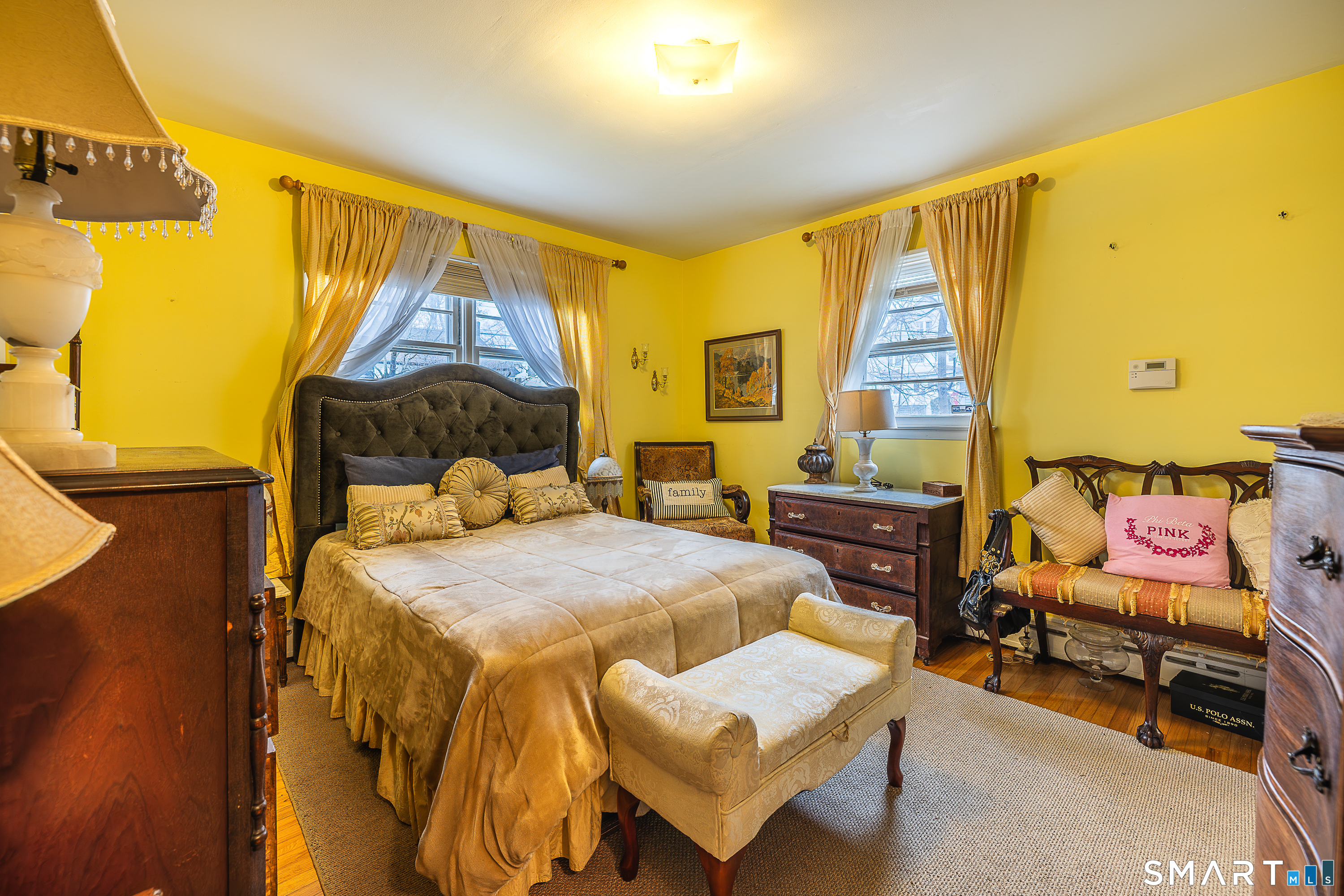 130 Holroyd Street Bridgeport, CT 06606 - Photo 16 of 29 a bedroom with a bed and wooden floor