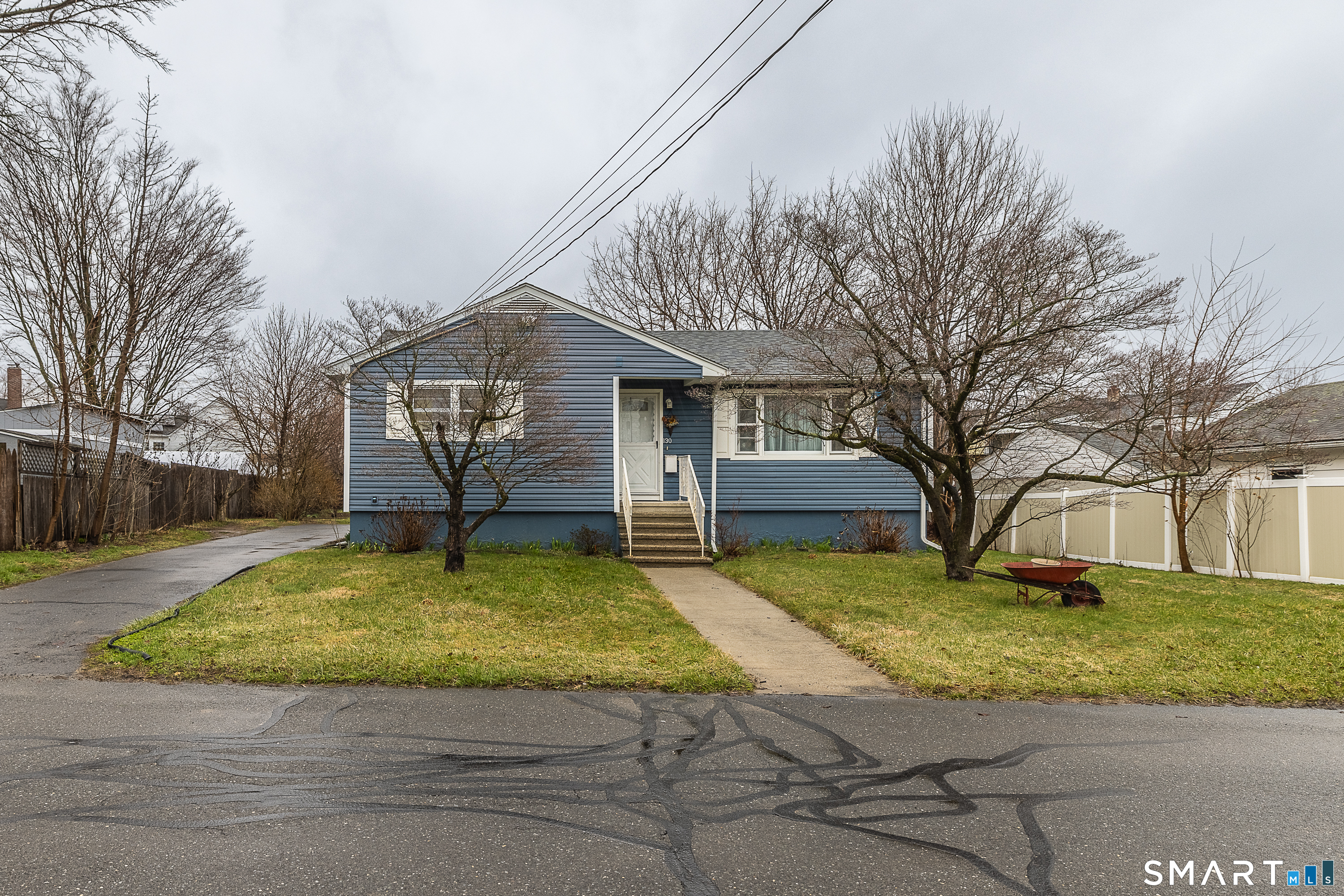 130 Holroyd Street Bridgeport, CT 06606 - Photo 2 of 29 a view of a yard with a house in the background