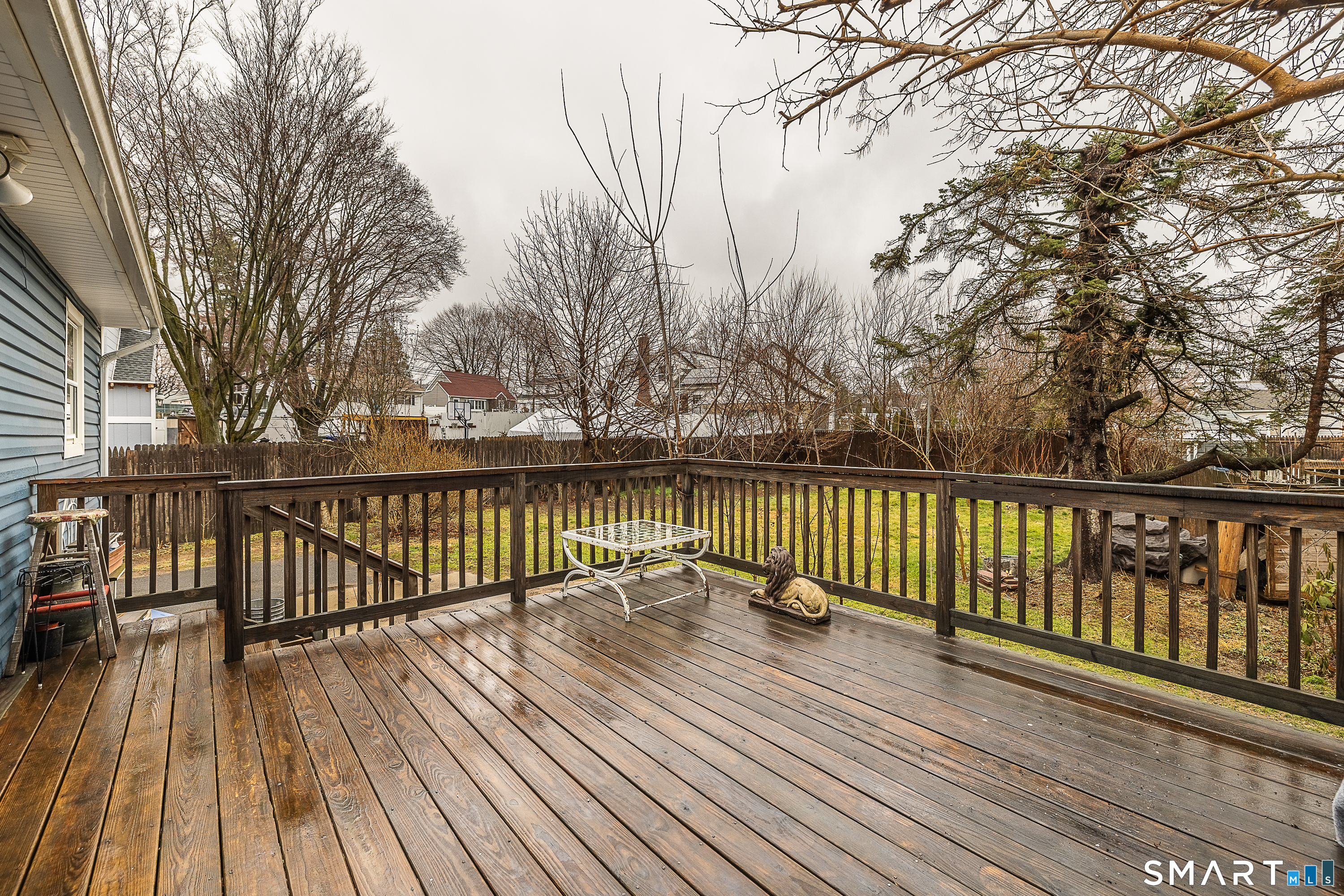 130 Holroyd Street Bridgeport, CT 06606 - Photo 27 of 29 a view of balcony with wooden floor and fence