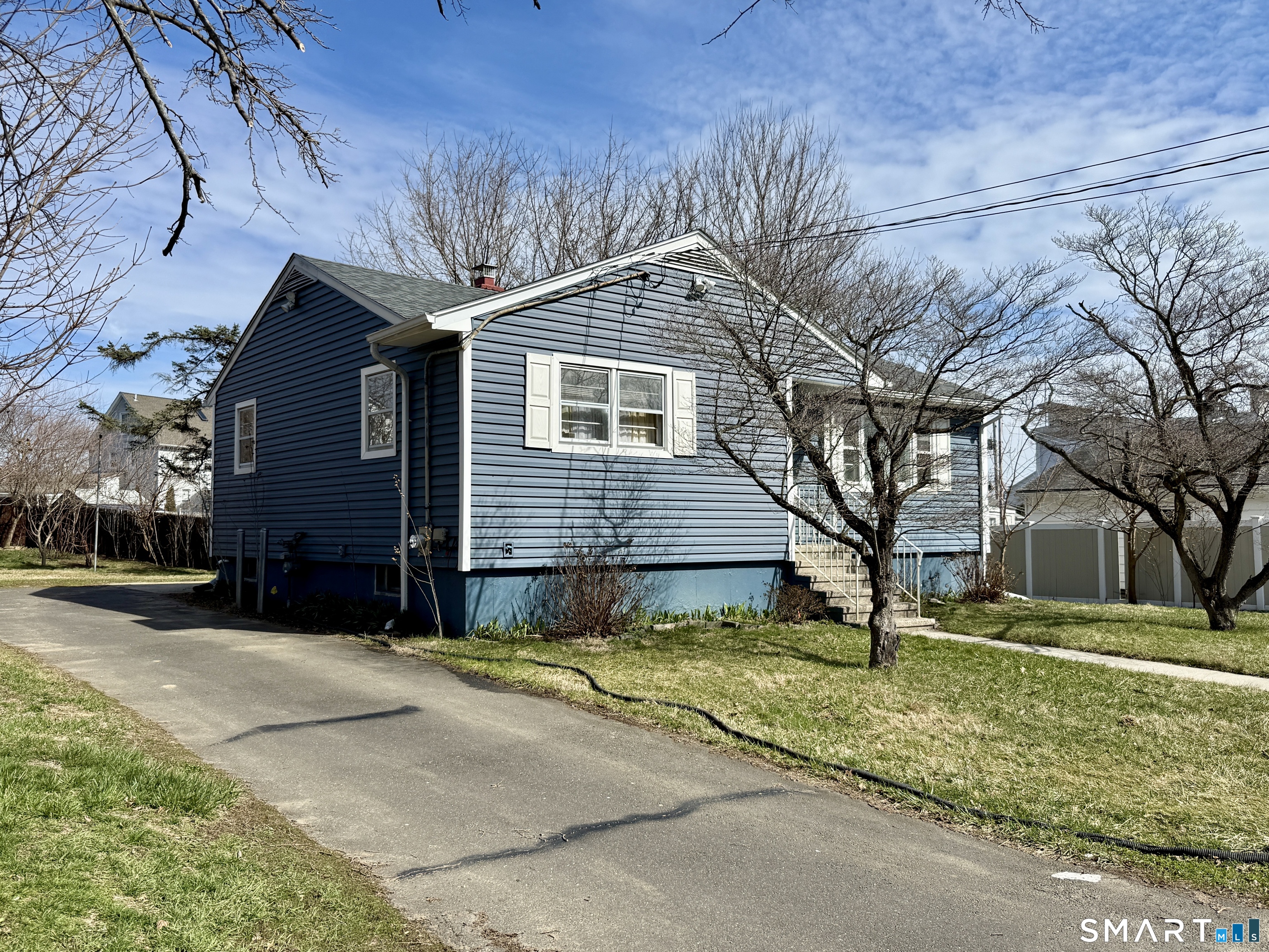 130 Holroyd Street Bridgeport, CT 06606 - Photo 3 of 29 a view of a house with a yard