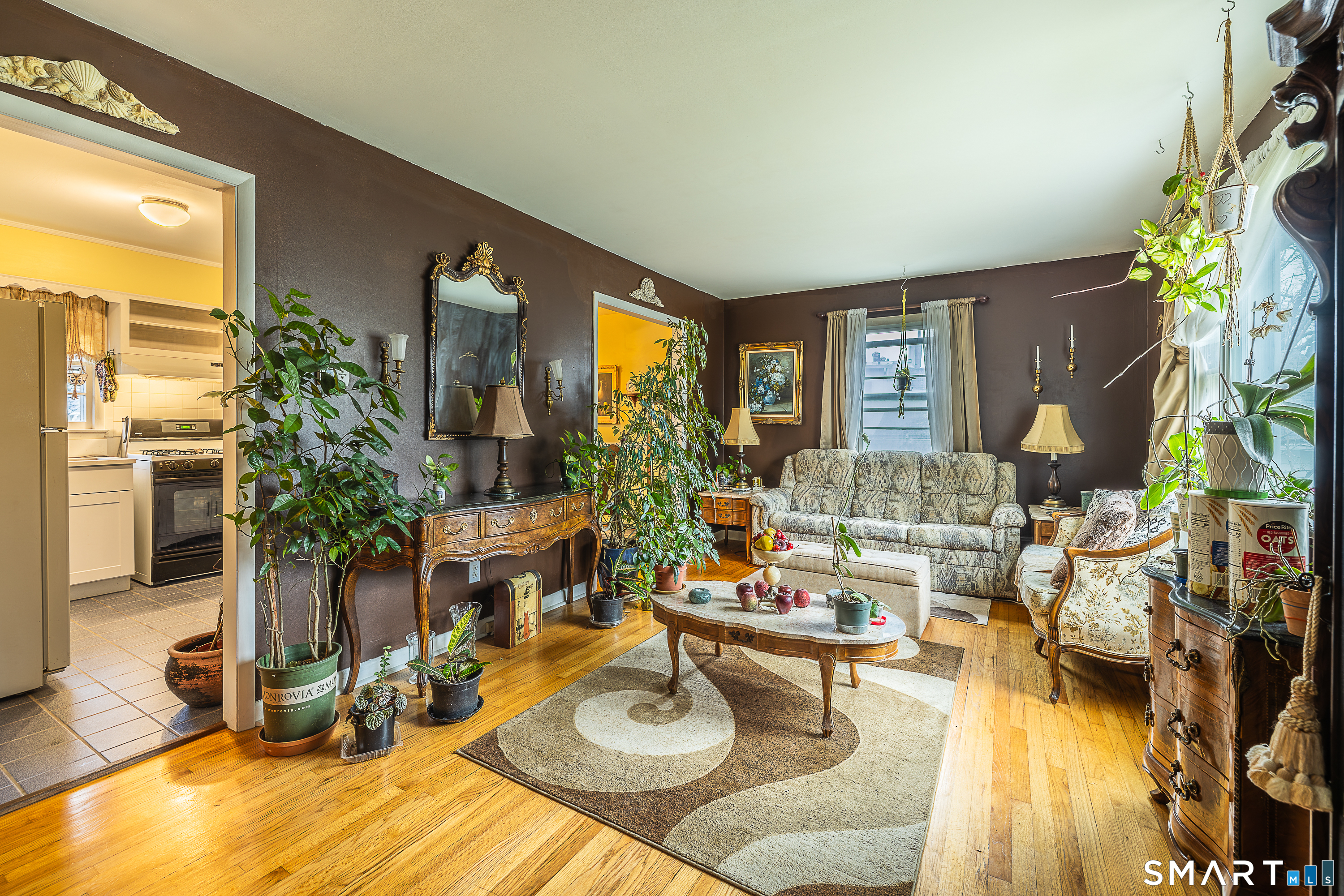 130 Holroyd Street Bridgeport, CT 06606 - Photo 5 of 29 a living room with furniture and a large window