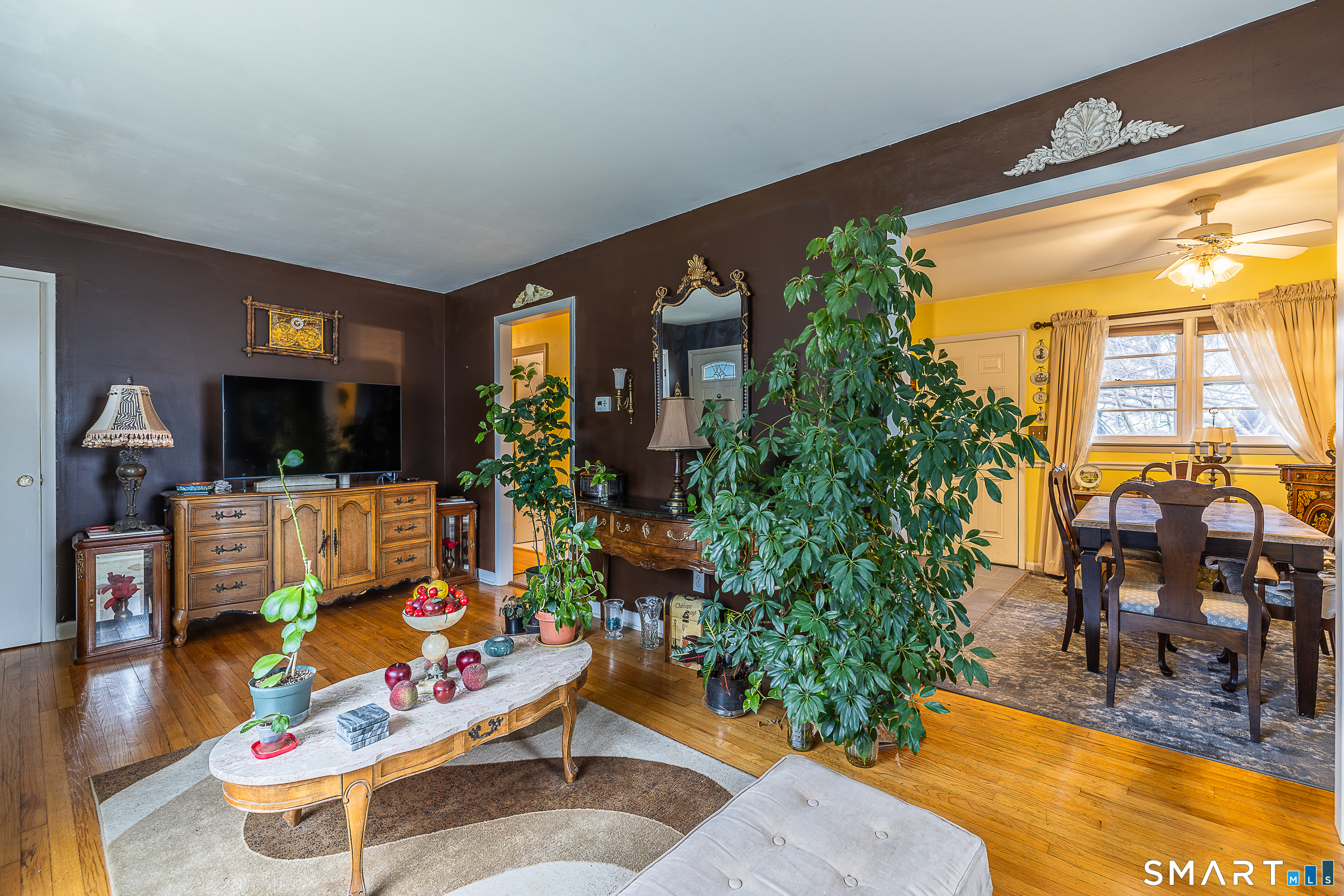 130 Holroyd Street Bridgeport, CT 06606 - Photo 7 of 29 a living room with furniture and a large mirror